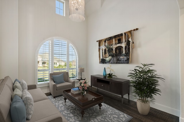 living room with wood-type flooring and a high ceiling