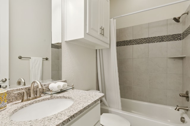 full bathroom featuring vanity, toilet, and shower / bathtub combination with curtain