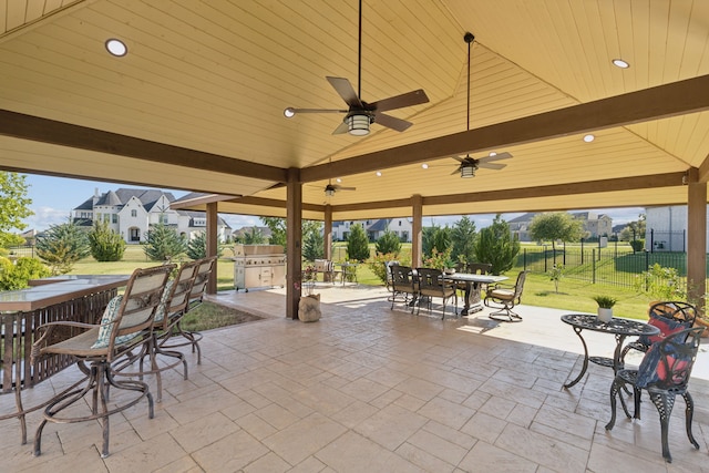 view of patio with ceiling fan and an outdoor kitchen