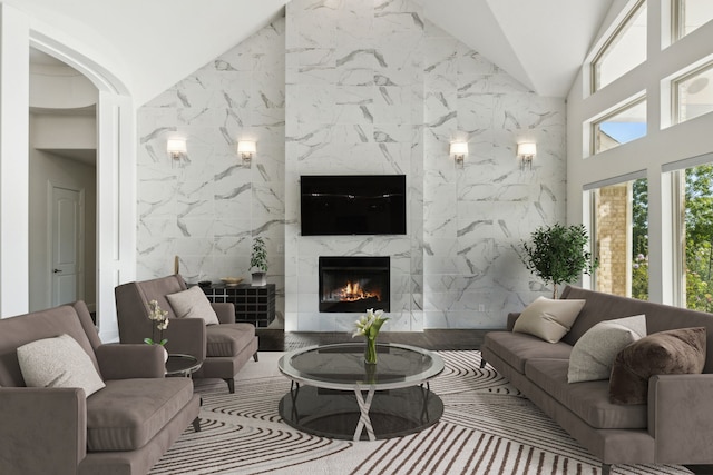 living room featuring tile walls and a premium fireplace