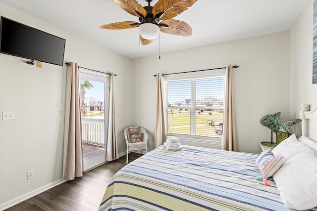 bedroom with access to outside, baseboards, dark wood-style floors, and multiple windows