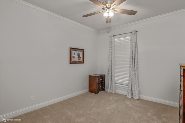 unfurnished bedroom featuring crown molding, light carpet, and ceiling fan