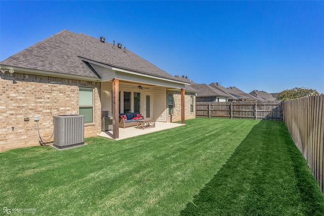 back of property featuring a patio, a yard, central AC, and ceiling fan