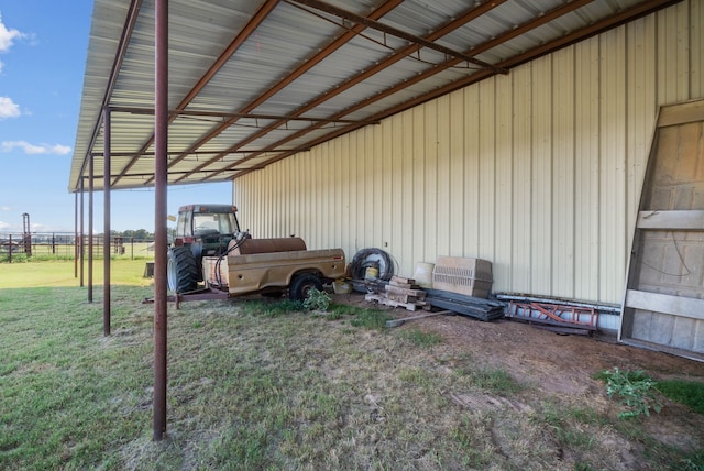 view of parking featuring a lawn