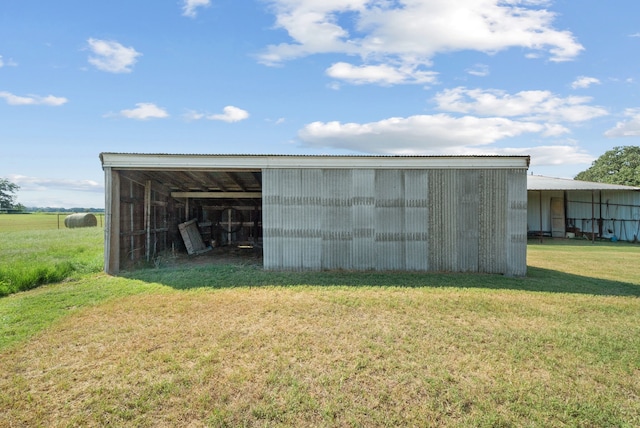 view of outdoor structure with a yard