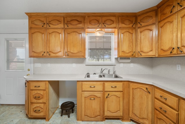 kitchen featuring a healthy amount of sunlight and sink