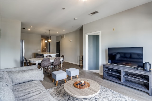 living room with light hardwood / wood-style floors