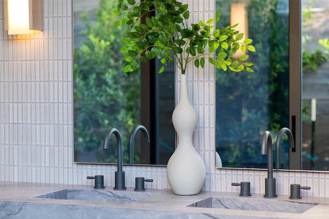 details featuring decorative backsplash and sink