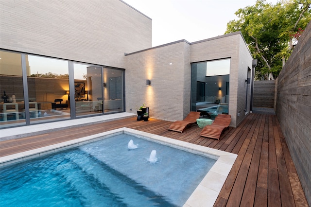 view of pool with a wooden deck