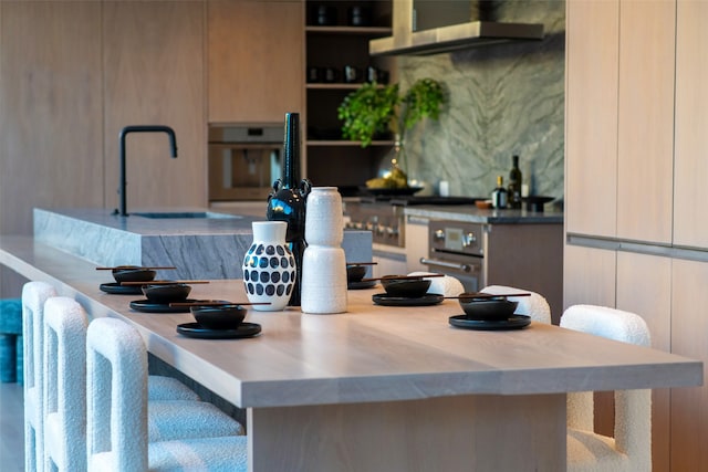 kitchen featuring wall oven and extractor fan