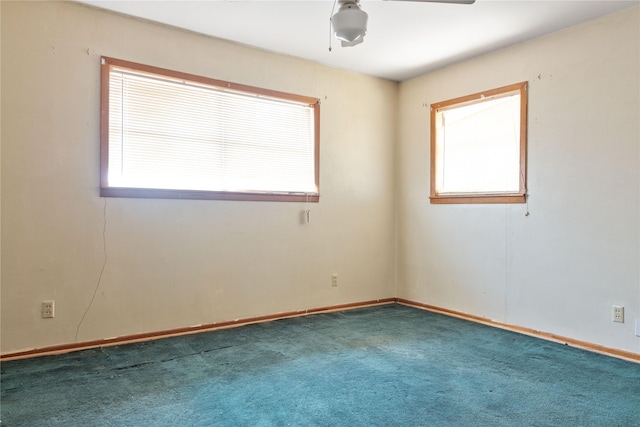 carpeted empty room featuring ceiling fan