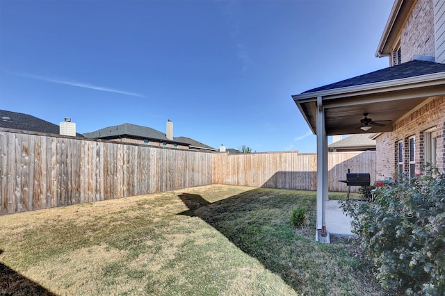 view of yard with ceiling fan