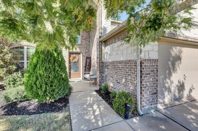 doorway to property featuring a garage