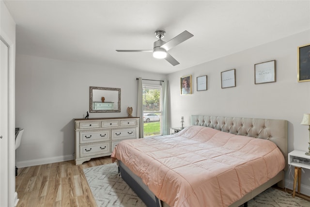 bedroom featuring light wood-type flooring and ceiling fan