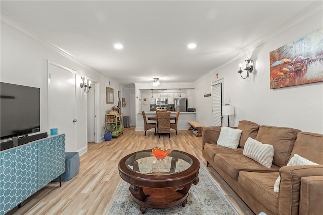 living room featuring light hardwood / wood-style floors and ornamental molding