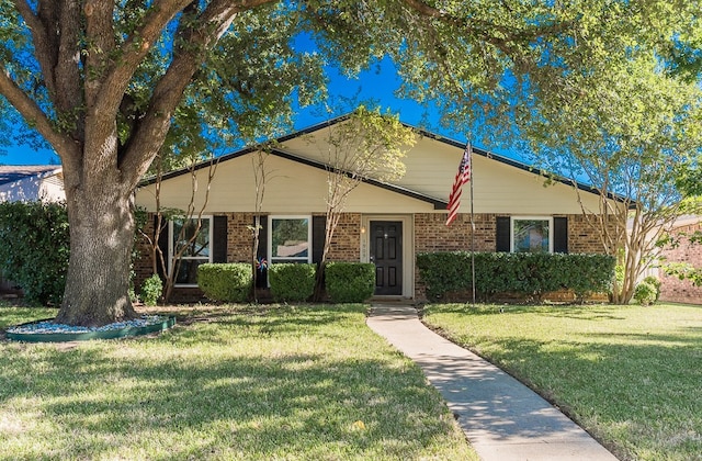 ranch-style home with a front lawn