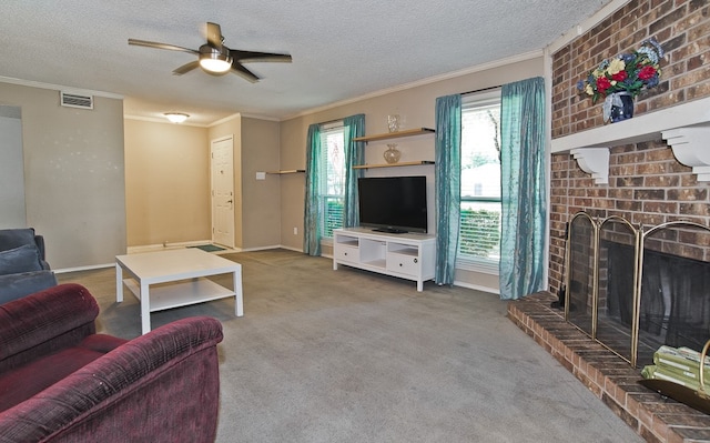 carpeted living room with ornamental molding, a textured ceiling, a fireplace, and ceiling fan