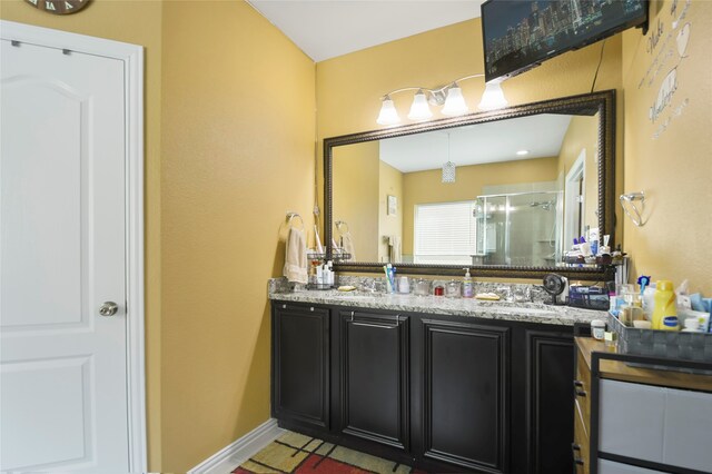 bathroom with vanity and walk in shower