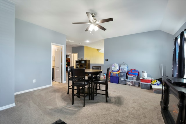 carpeted dining area featuring lofted ceiling and ceiling fan