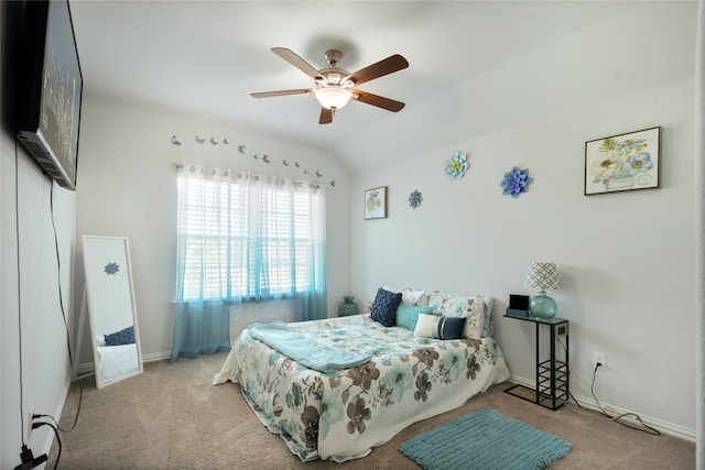 bedroom featuring ceiling fan, lofted ceiling, and light colored carpet