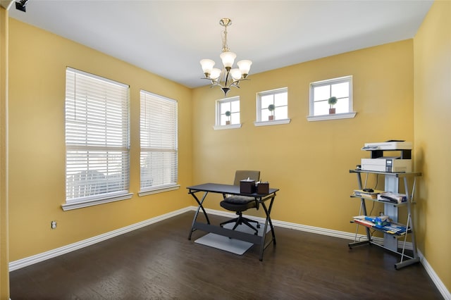 office space featuring a notable chandelier and dark hardwood / wood-style flooring