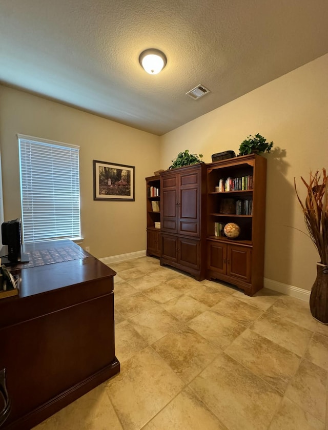 office area featuring a textured ceiling