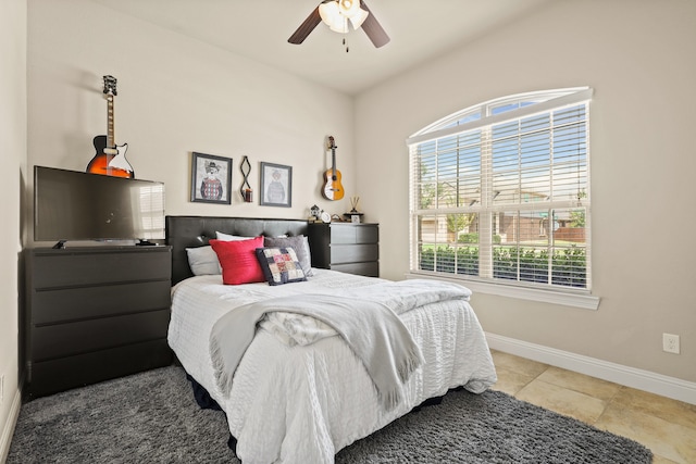 bedroom featuring multiple windows and ceiling fan