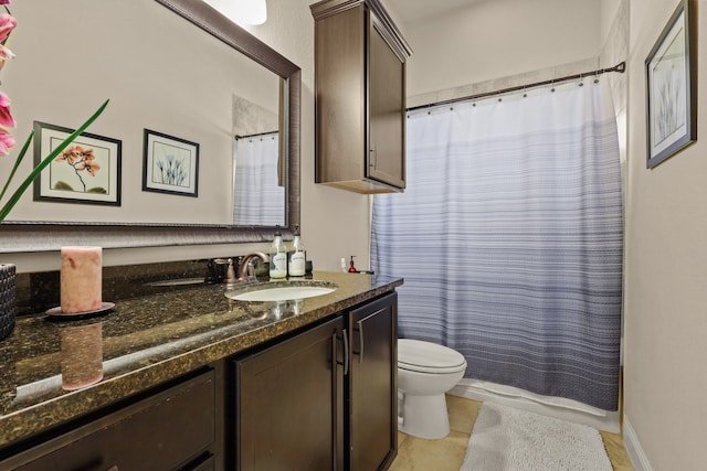 bathroom with vanity, a shower with curtain, toilet, and tile patterned floors