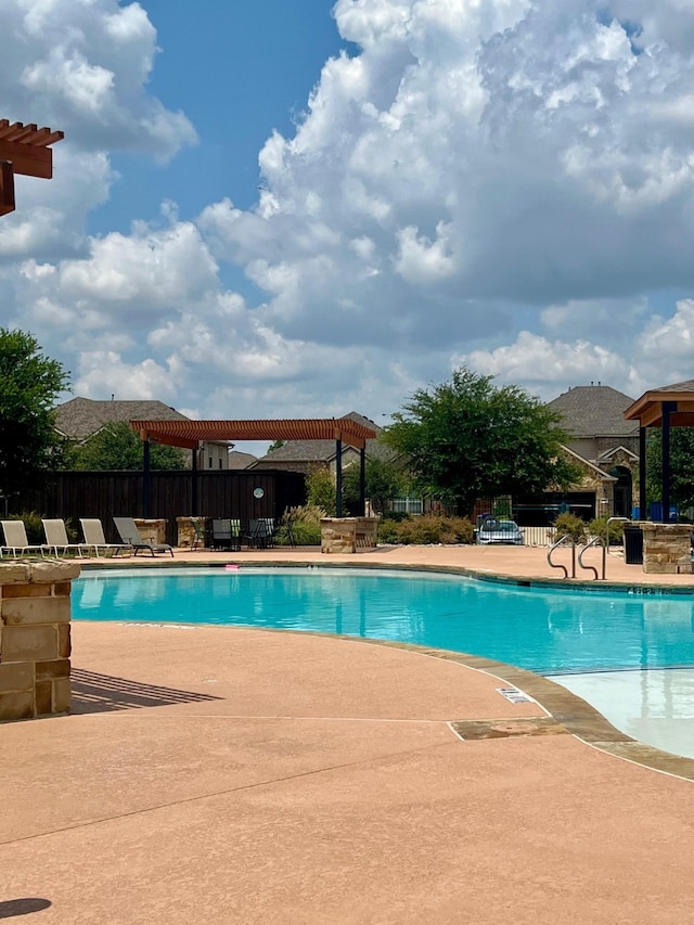 view of swimming pool featuring a patio