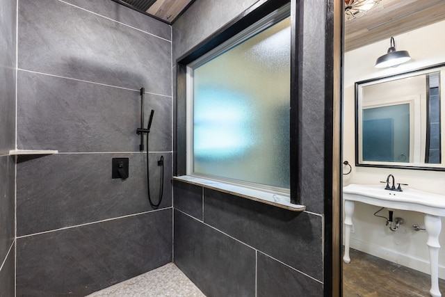 bathroom with a tile shower