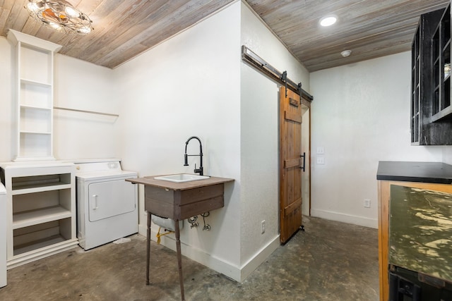 washroom with washer / dryer, a barn door, sink, and wooden ceiling