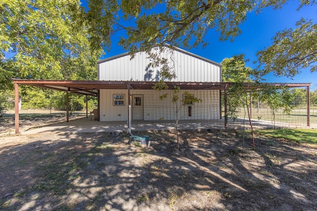 view of outbuilding with a carport