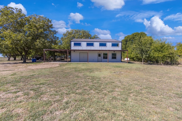 view of outdoor structure featuring a yard and a carport