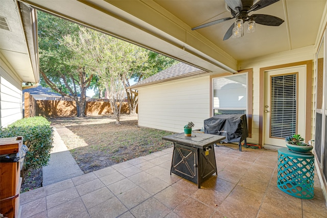 view of patio featuring grilling area, ceiling fan, and an outdoor fire pit