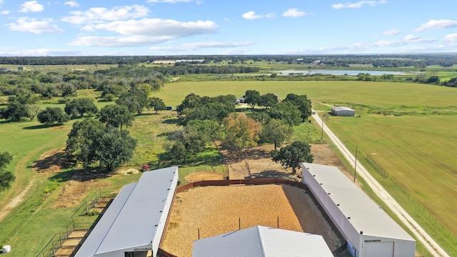 drone / aerial view with a rural view and a water view