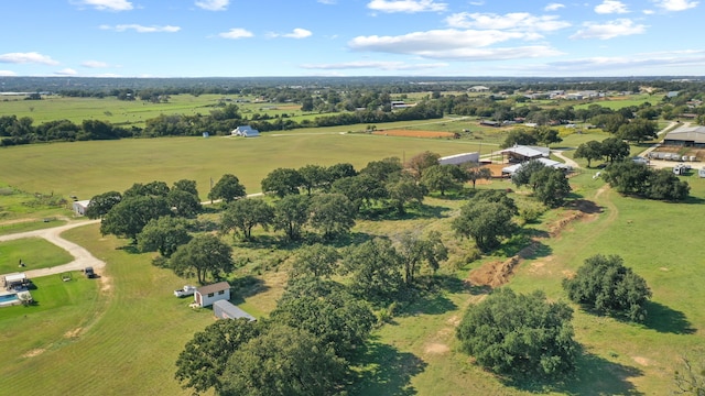 birds eye view of property with a rural view