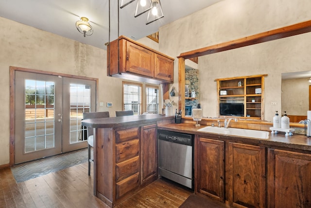 kitchen with sink, french doors, kitchen peninsula, stainless steel dishwasher, and dark wood-type flooring