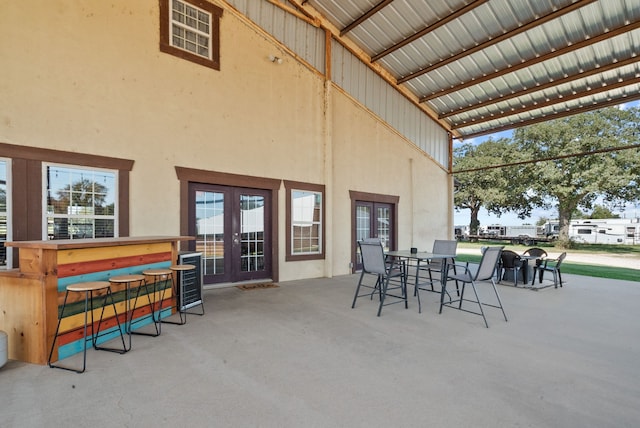 view of patio / terrace with an outdoor bar and french doors