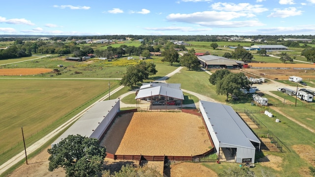 birds eye view of property with a rural view