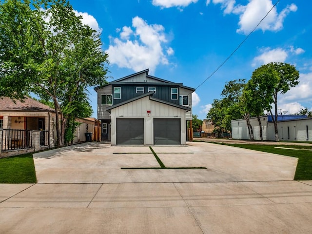 717-719 Sunset Ave, Dallas, TX 75208 - exterior space featuring fence, an attached garage, board and batten siding, and concrete driveway