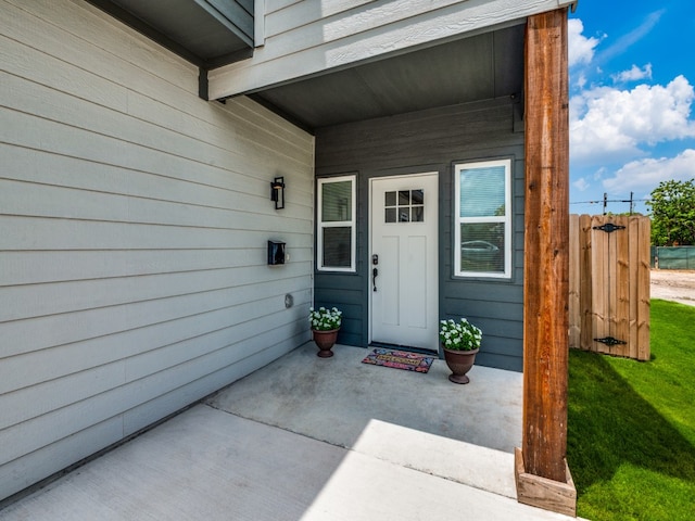 doorway to property featuring a yard