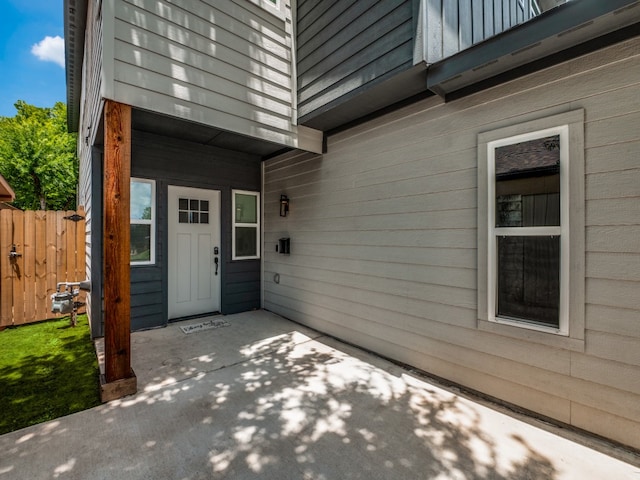 doorway to property with a patio area