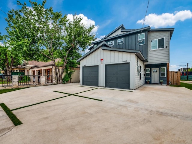 717-719 Sunset Ave, Dallas, TX 75208 - modern farmhouse featuring board and batten siding, fence, concrete driveway, and a garage