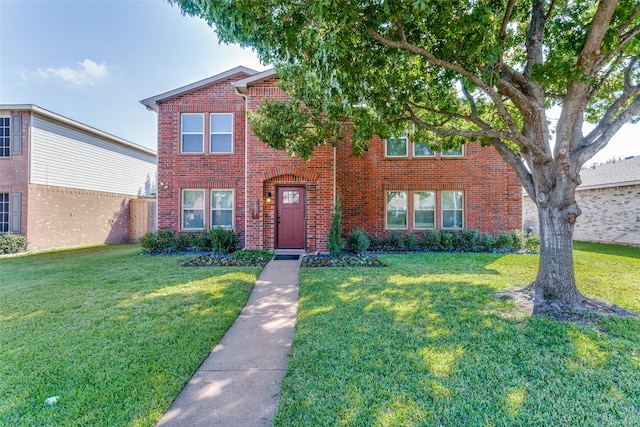 view of front of home with a front lawn