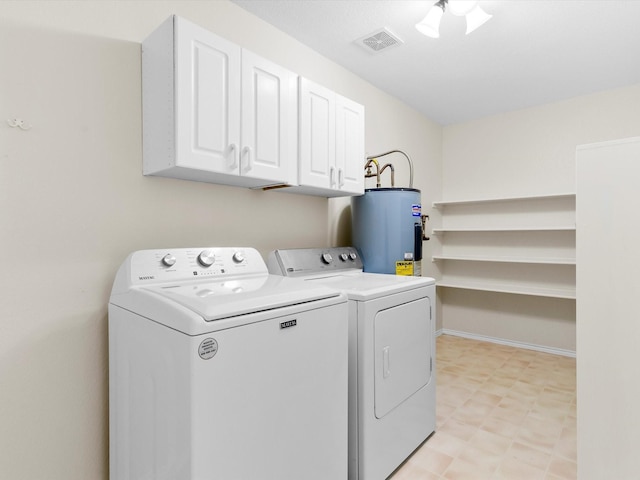 1517 Windward Ln, Wylie, TX 75098 - washroom with electric water heater, independent washer and dryer, cabinet space, and light floors