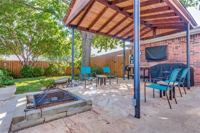 view of patio / terrace with a fire pit