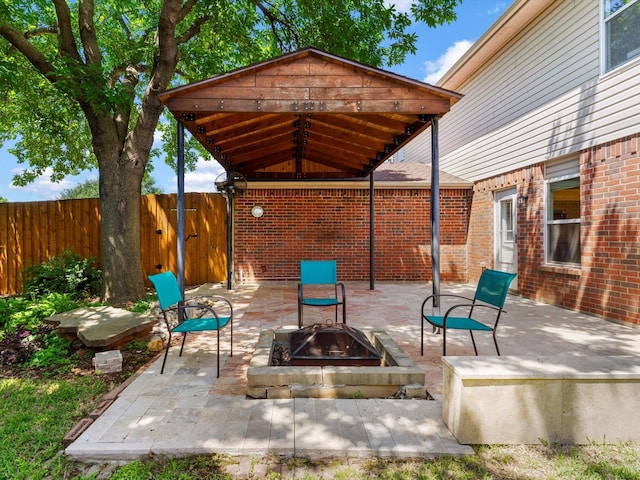 1517 Windward Ln, Wylie, TX 75098 - view of patio featuring an outdoor fire pit, fence, and a gazebo
