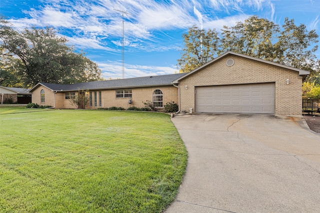 single story home with a front yard and a garage