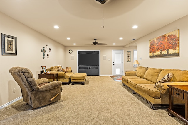 living room with ceiling fan and carpet floors