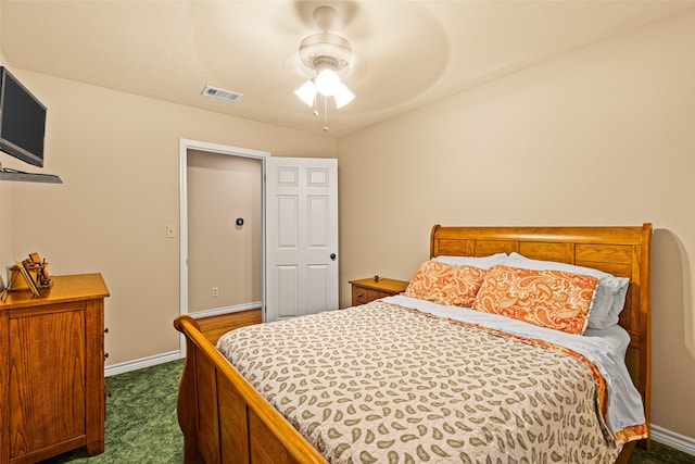 bedroom with dark colored carpet and ceiling fan